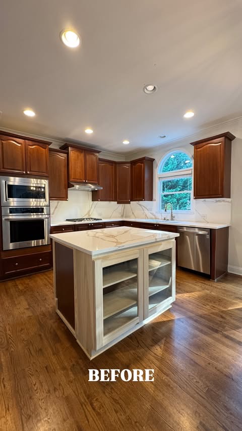 A real client kitchen before cabinet painting, dark-stained cabinets