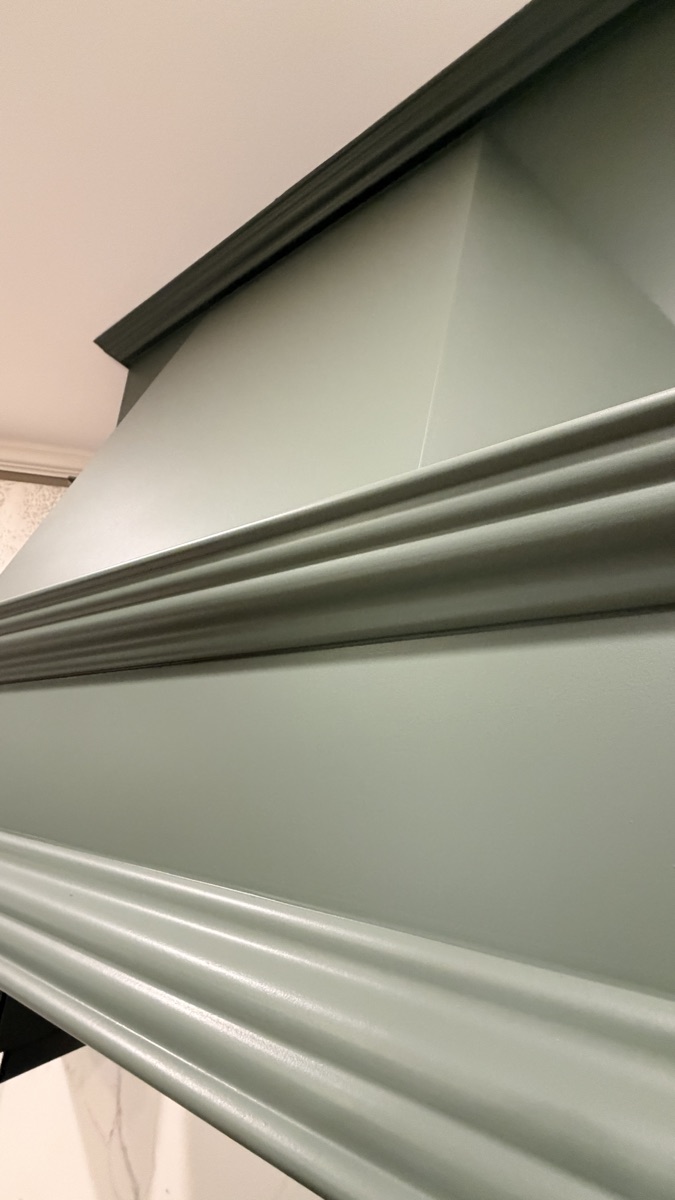 Real finished cabinet hood molding detail in Rosemary green, a Cabinet Painting Guys client job