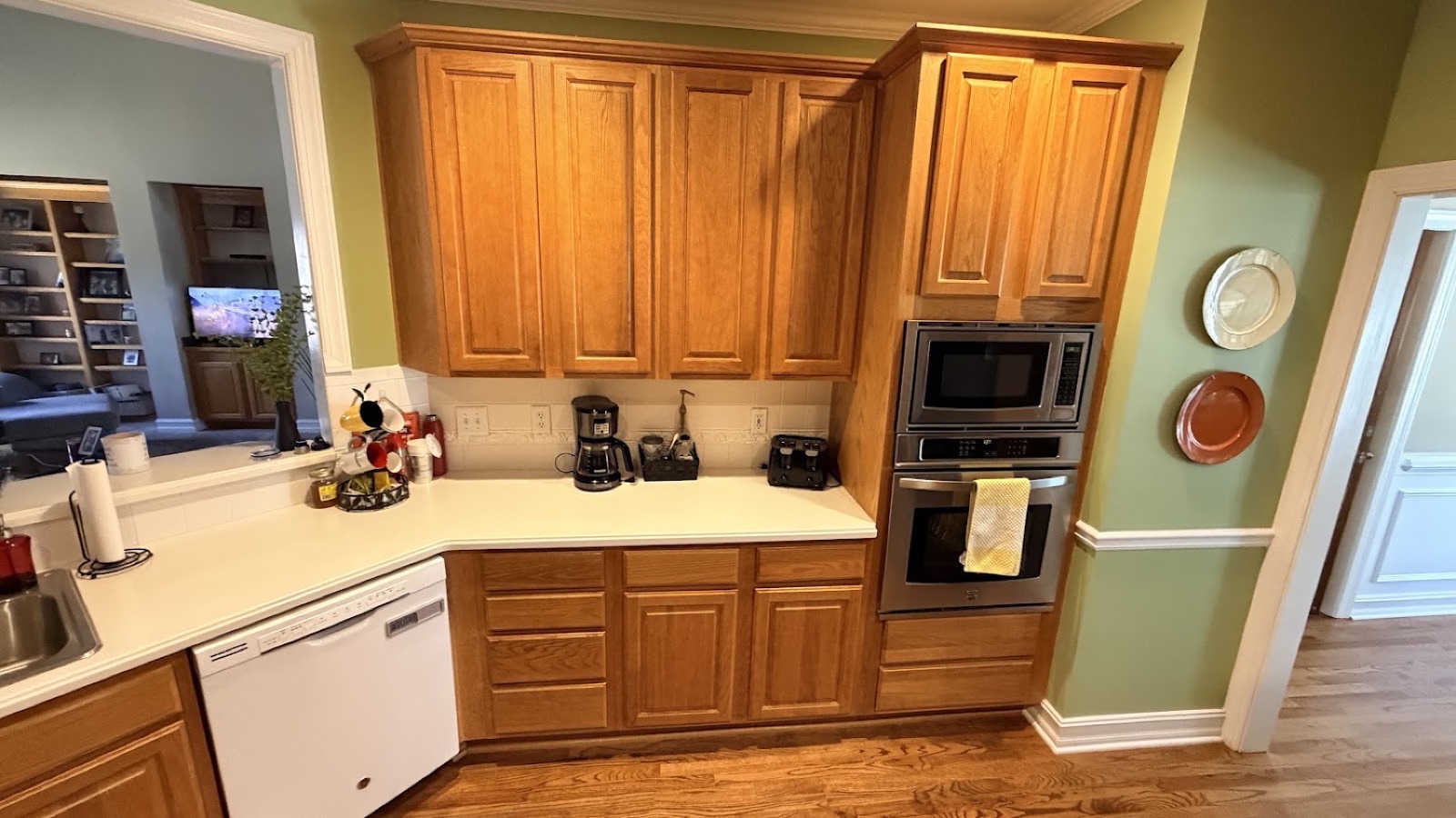 Real Woodstock-area client kitchen before the color change — honey-oak cabinets