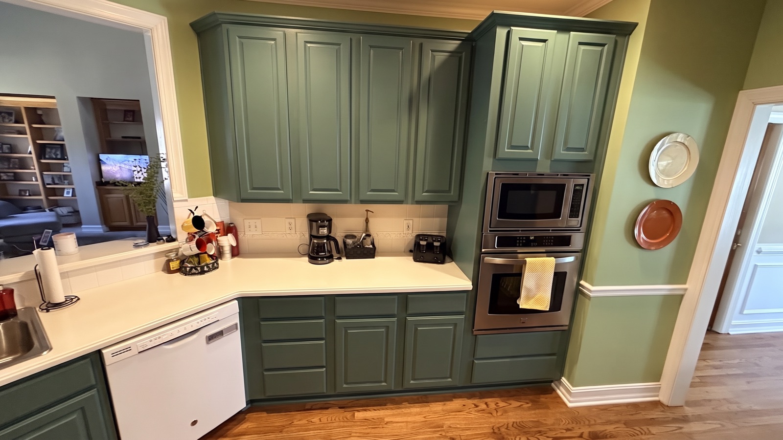 AI color preview — the same oak kitchen visualized in Rosemary