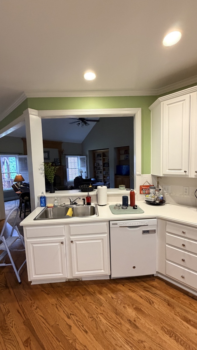Real finished kitchen peninsula with White Flour painted cabinets, a Cabinet Painting Guys client job