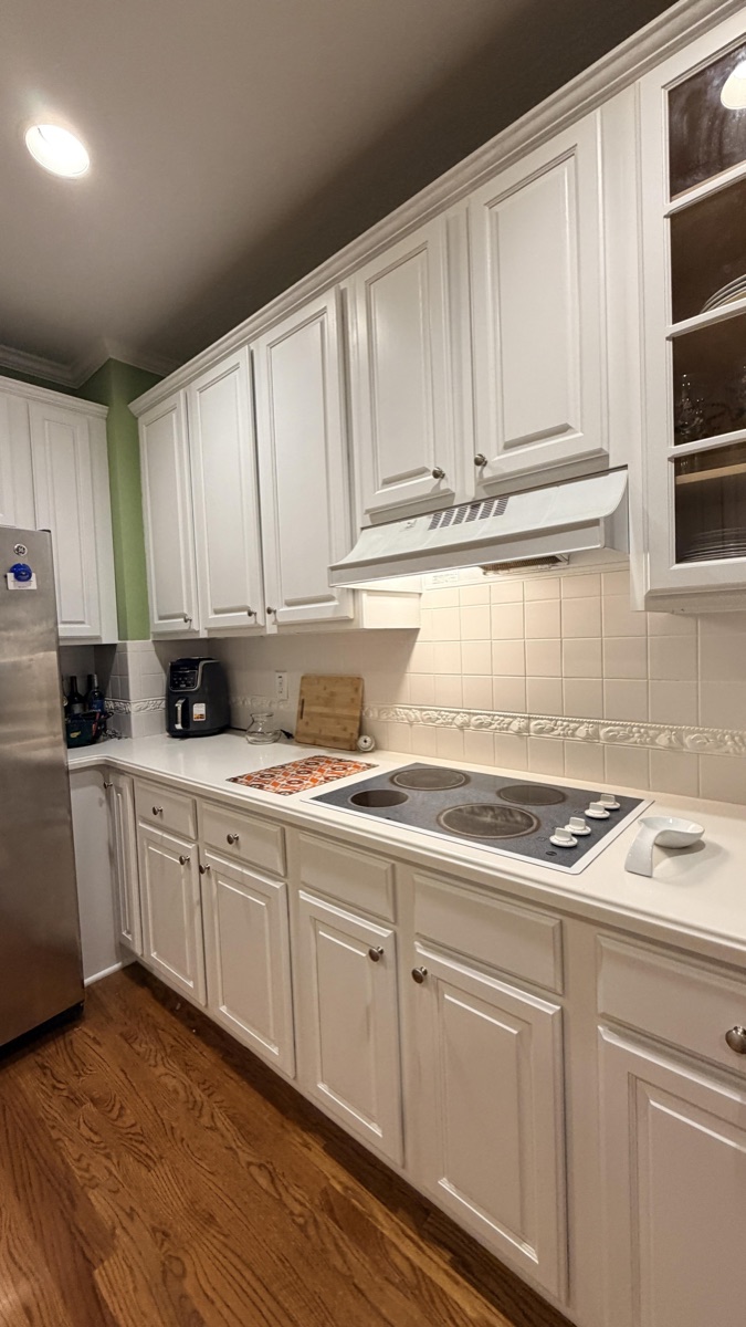 Real finished cabinets in White Flour above a cooktop, a Cabinet Painting Guys client job